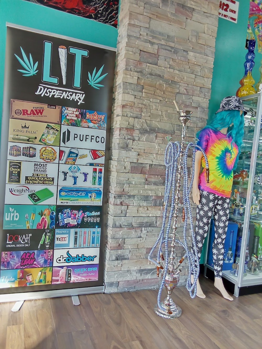 LIT Dispensary brand wall showcasing RAW, Puffco, King Palm, Dr. Dabber, Geek Bar, Hyde, Lookah, Urb and more, with hookah display